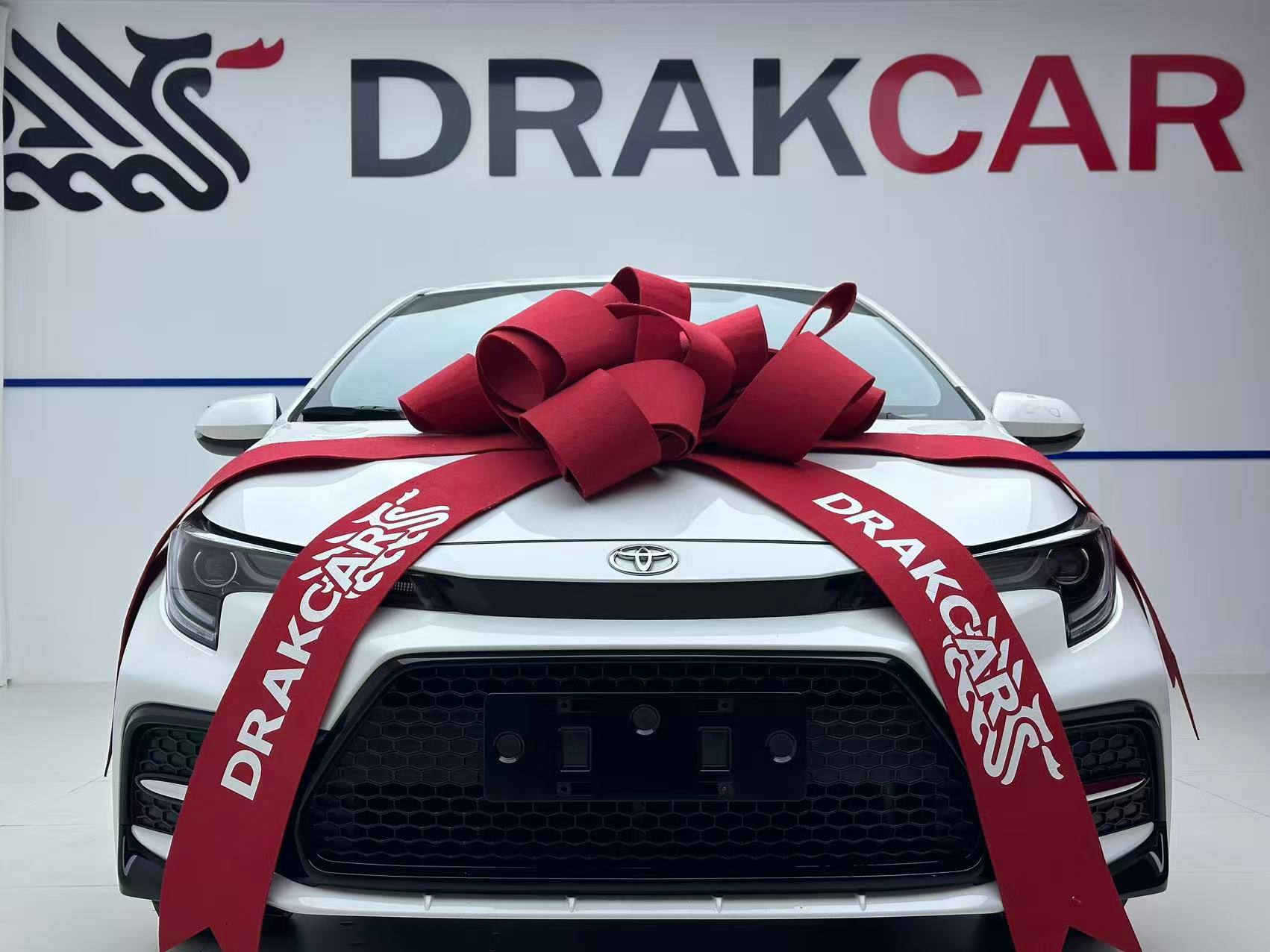 Toyota Levin, белый — с фирменным бантом DrakCar